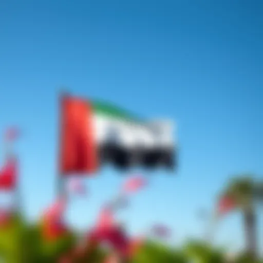 The UAE national flag waving proudly against a clear blue sky